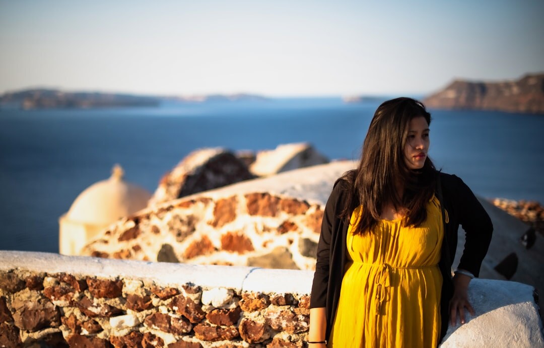 couple watching sunset in santorini