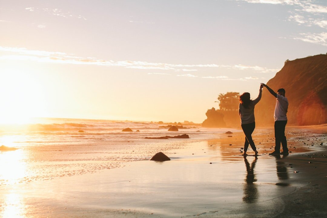 romantic couple on beach at sunset