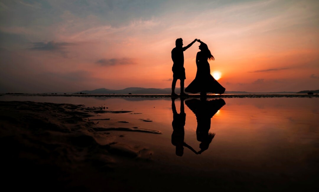 romantic couple on beach at sunset